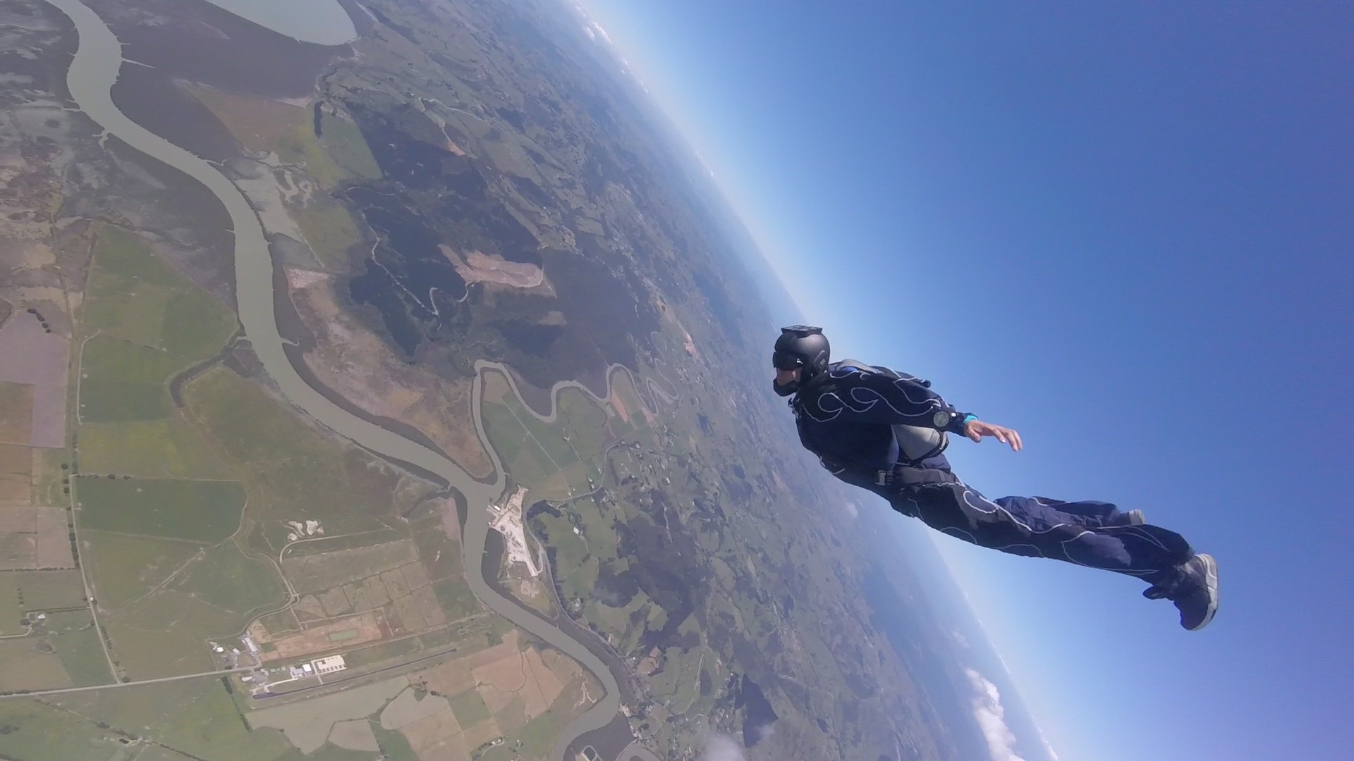 Gus solo skydiving over Auckland success story